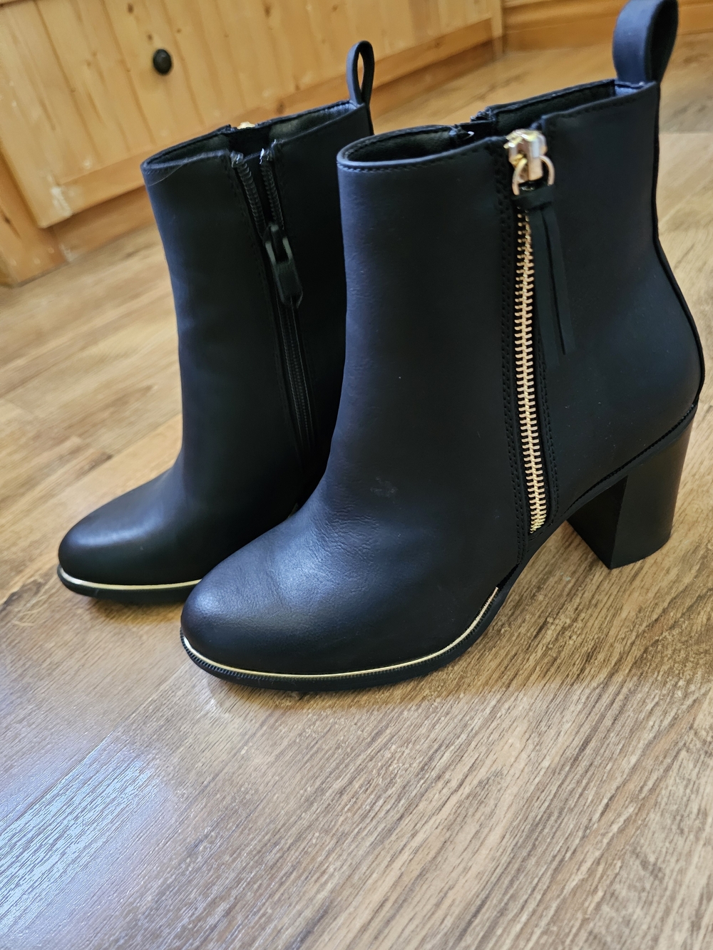 Allure Black Ankle Heeled Boots with Gold Zip Accent